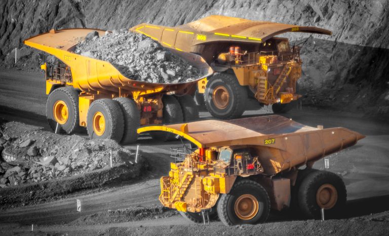 Three,Trucks,In,A,Modern,Gold,Mine,In,Australia.,Spot
