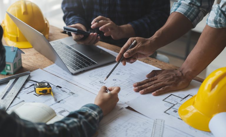 Architectural engineer team meeting drawing and calculations for architectural structures