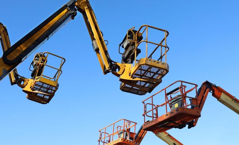 Two,Aerial,Working,Platforms,Of,Cherry,Pickers,In,Front,Of