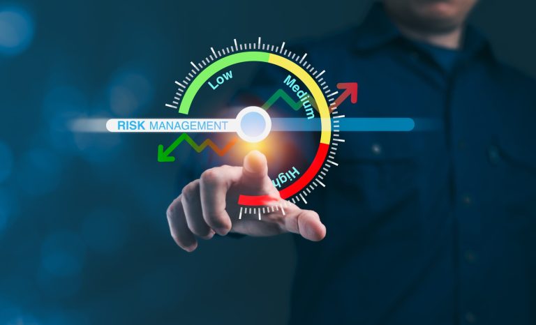 Businessman,Is,Pointing,A,Risk,Management,Bar,Displayed,On,A